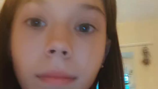 green-eyed girl showing herself off